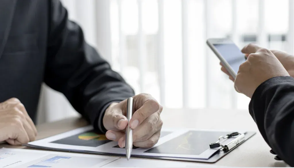 two man with pen and phone